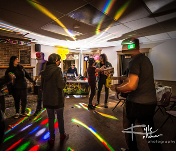 Picture of people dancing in front of Hayward Sound Work Station